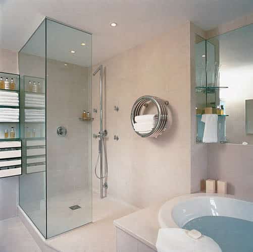 A large open plan showering facility with glass screen