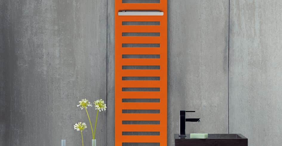 An orange Zehnder tall wall mounted radiator