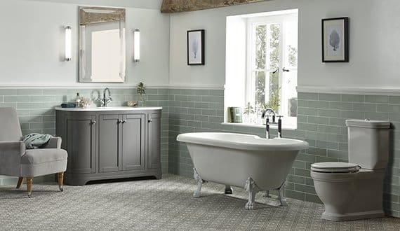 Laura Ashley Bathrooms, green ceramic tiles, toilet, free standing bath and sink unit