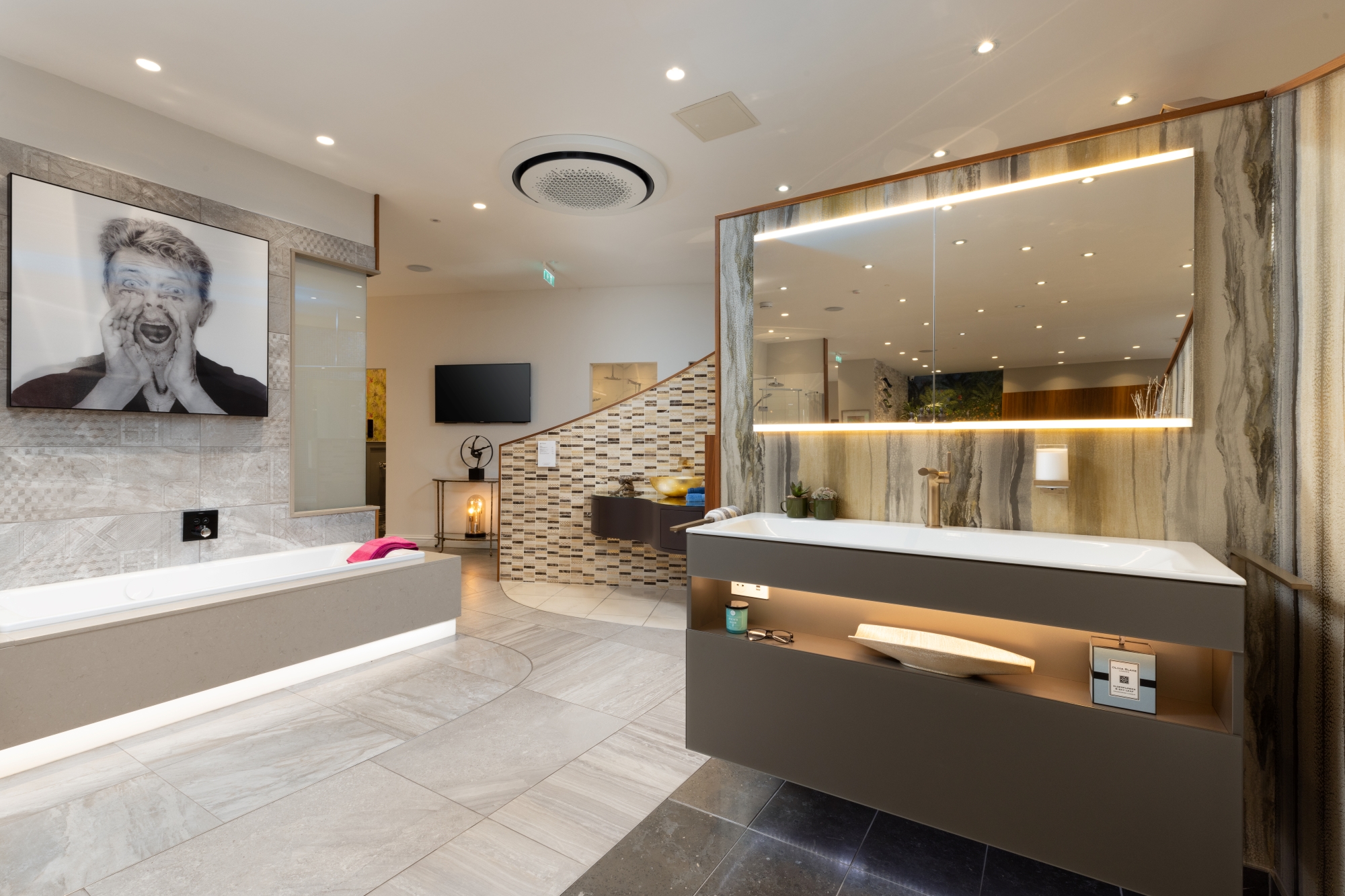 A large vanity unit and a sizeable mirror are on display in our spacious bathroom showroom in Edinburgh.