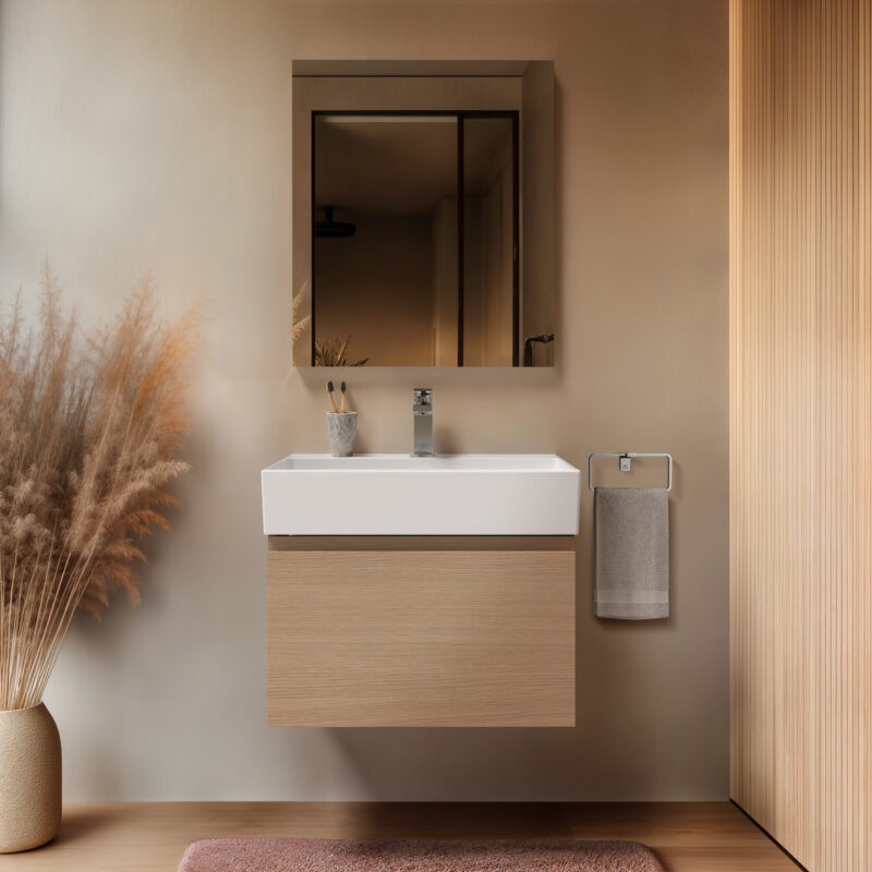 A wall-mounted vanity in oak finish with a large mirror above it.