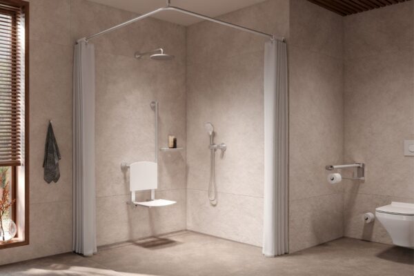 A nicely installed mobility bathroom with an overhead shower, foldable seat, and grab bars. a large curtains above creates