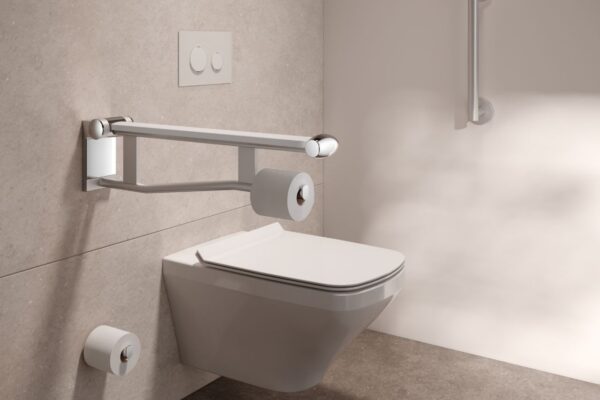 A WC installed in an accessible bathroom features two grab bars at an adequate height for ease of sitting and standing.