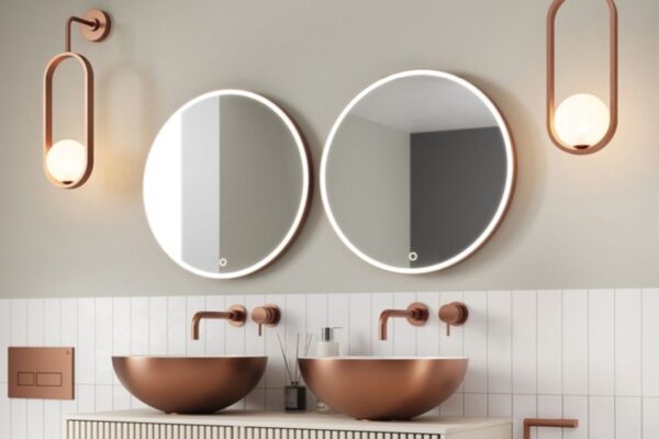 a double round LED mirror and a basin with feature lighting installed in an accessible bathroom