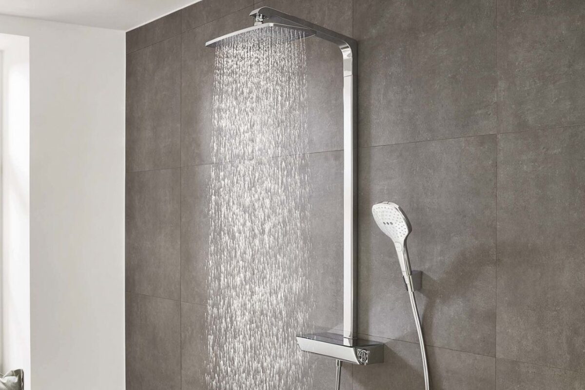 A luxury overhead shower with a shower arm installed in an accessible bathroom.