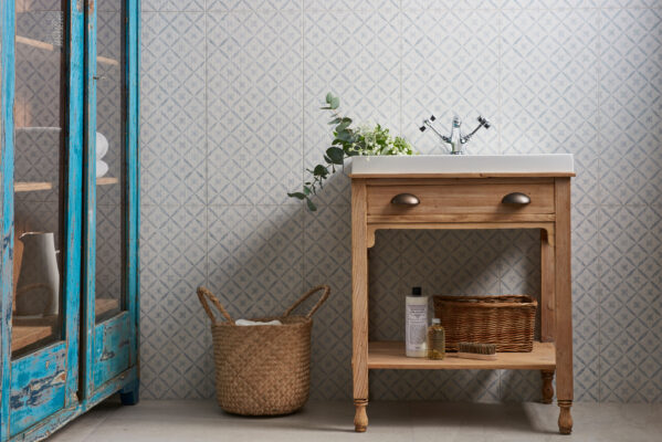 A traditional-style bathroom with storage beneath the basin.