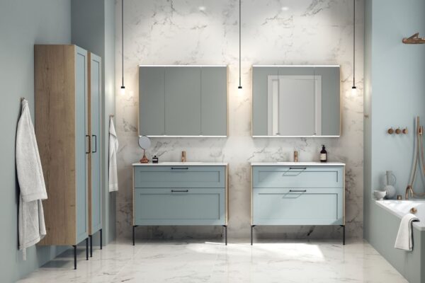 A traditional-style bathroom featuring elegant bathroom furniture, including a double vanity unit and ample storage, all in a pastel sky colour.
