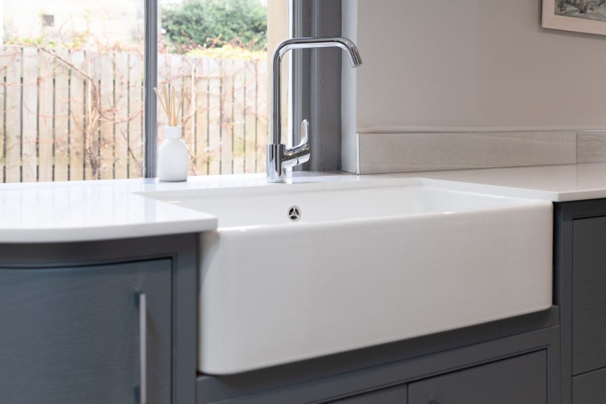 Farmhouse-style sink with a mixer installed as part of the whole home renovation.