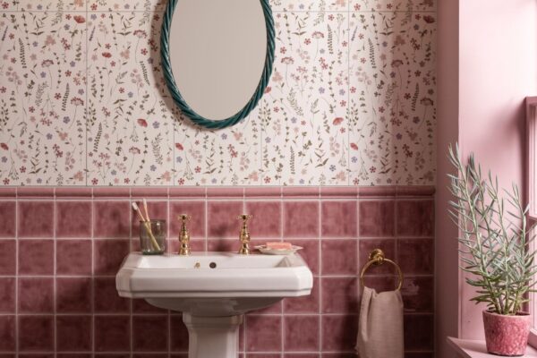 A traditional-style cloakroom with floral wallpaper and tiles creates a sleek design.