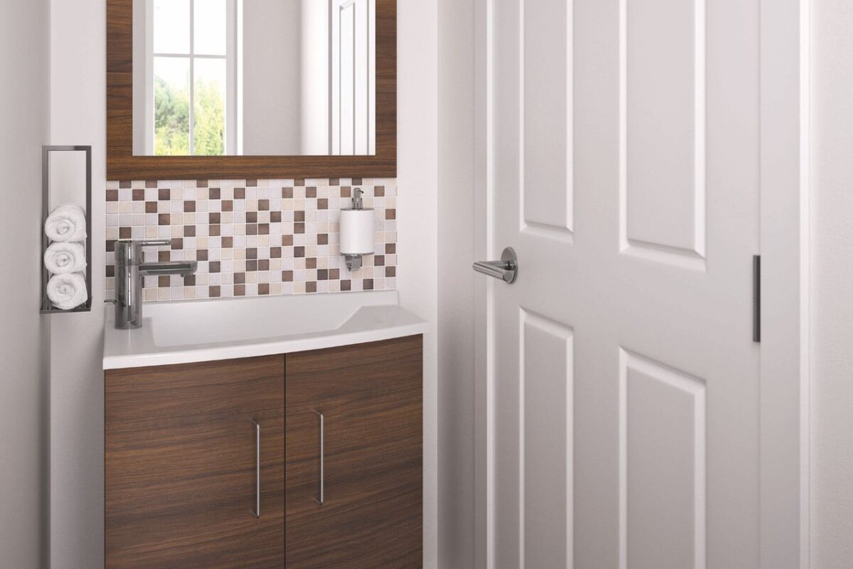 Compact modern cloakroom design featuring a vanity unit and mirror finished in walnut.