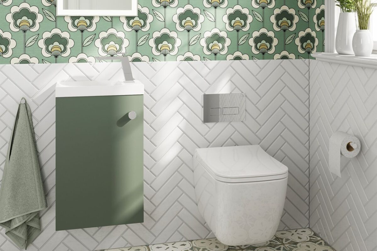 A cloakroom featuring a smooth colour scheme, complemented by floral wallpaper and white chevron tiles.