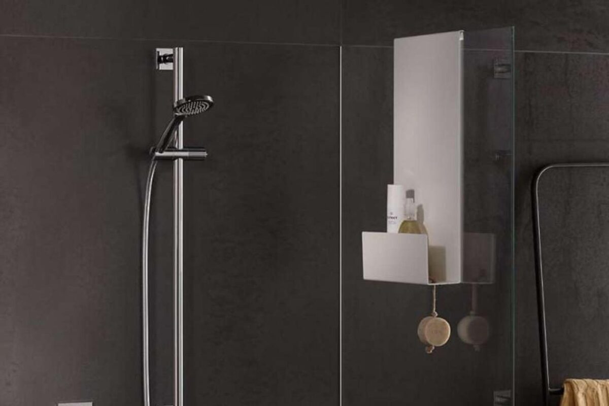 Modern shower area with hanging basket serving as storage for shampoo bottles.