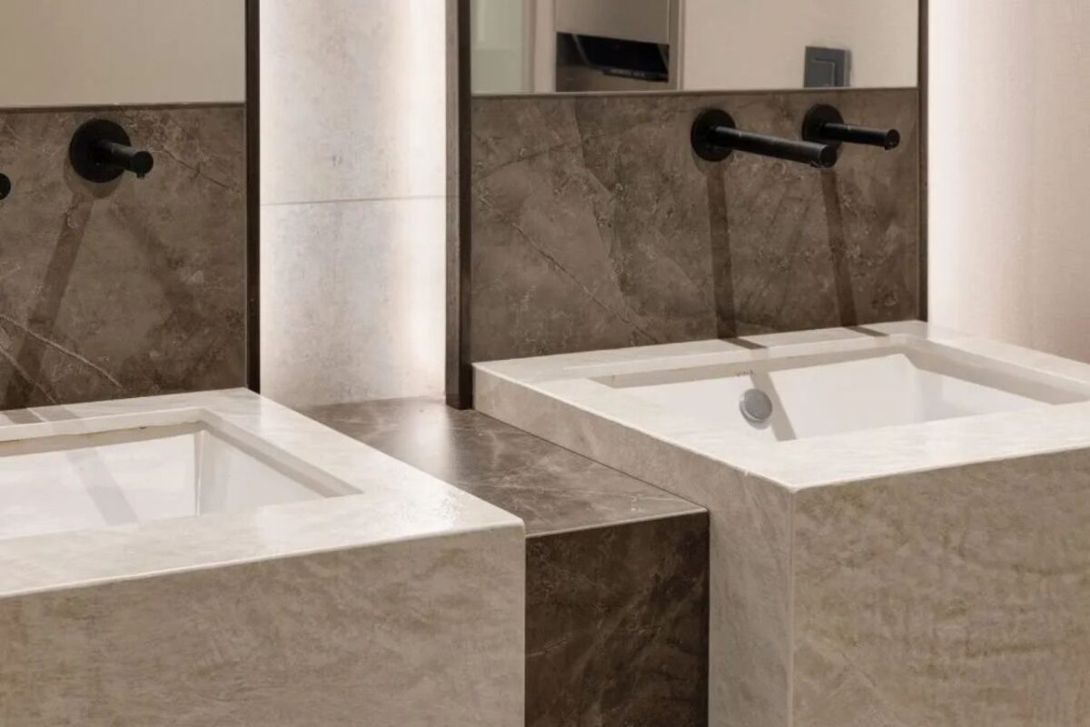 A modern bathroom with a Dekton worktop and splashback.
