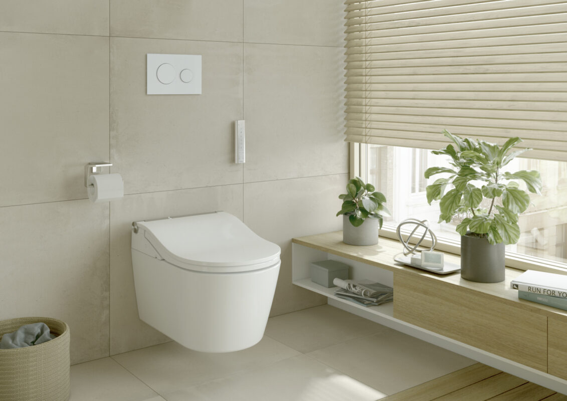 The WASHLET toilet from TOTO is installed in a contemporary bathroom with a white finish flush plate and bathroom furniture.